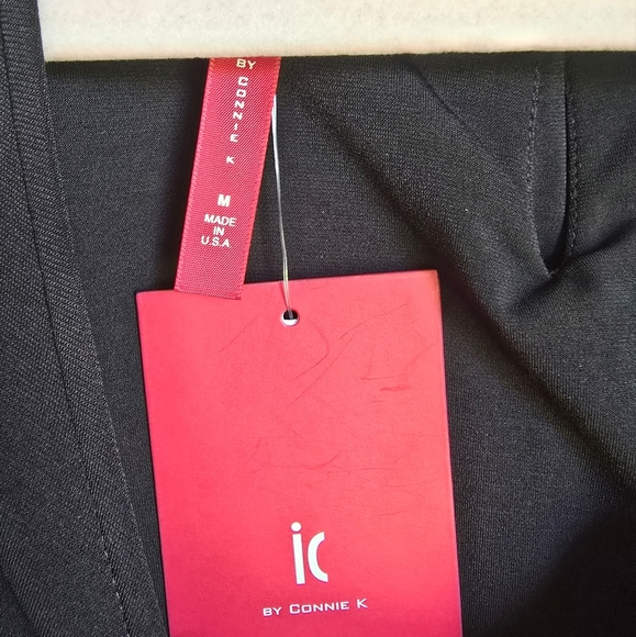 IC COLLECTION Connie K New Black Laser Cut Twist Pocket Jersey Top SZ Medium - Picture 8 of 10